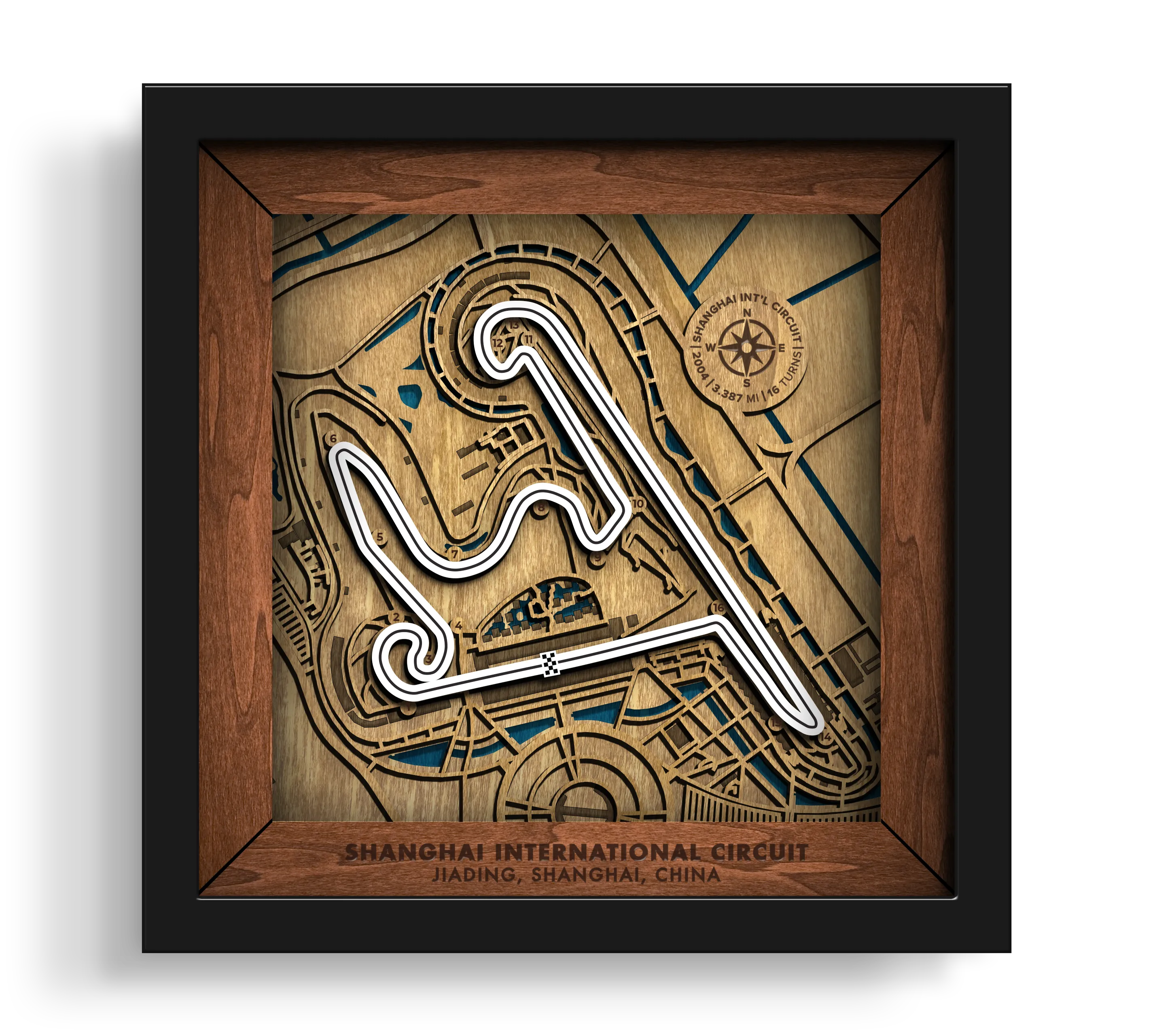 Handcrafted Shanghai International Circuit layered wooden racetrack wall art in a black frame.