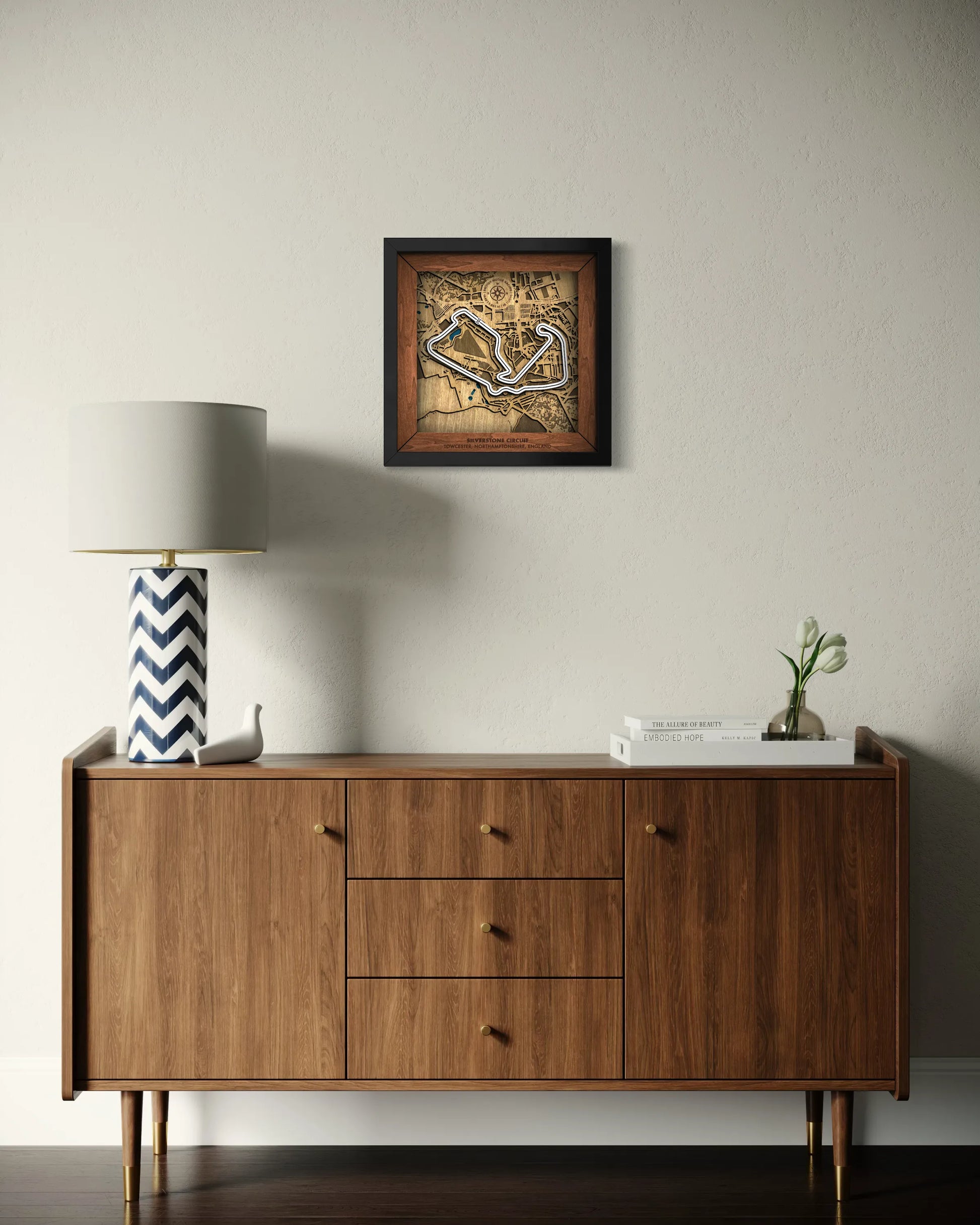 Handcrafted Silverstone Circuit layered wooden racetrack wall art displayed in a modern living room.