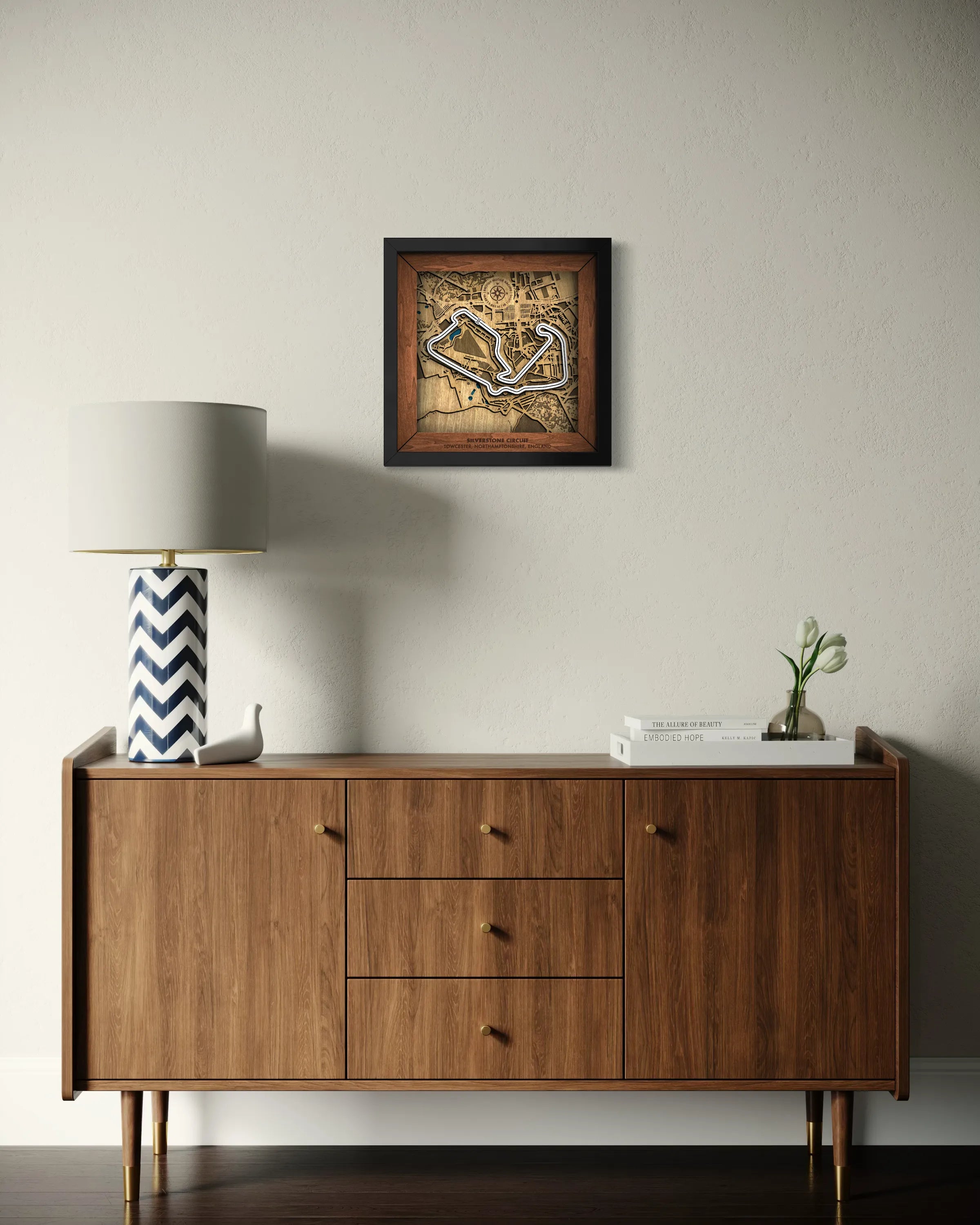 Handcrafted Silverstone Circuit layered wooden racetrack wall art displayed in a modern living room.