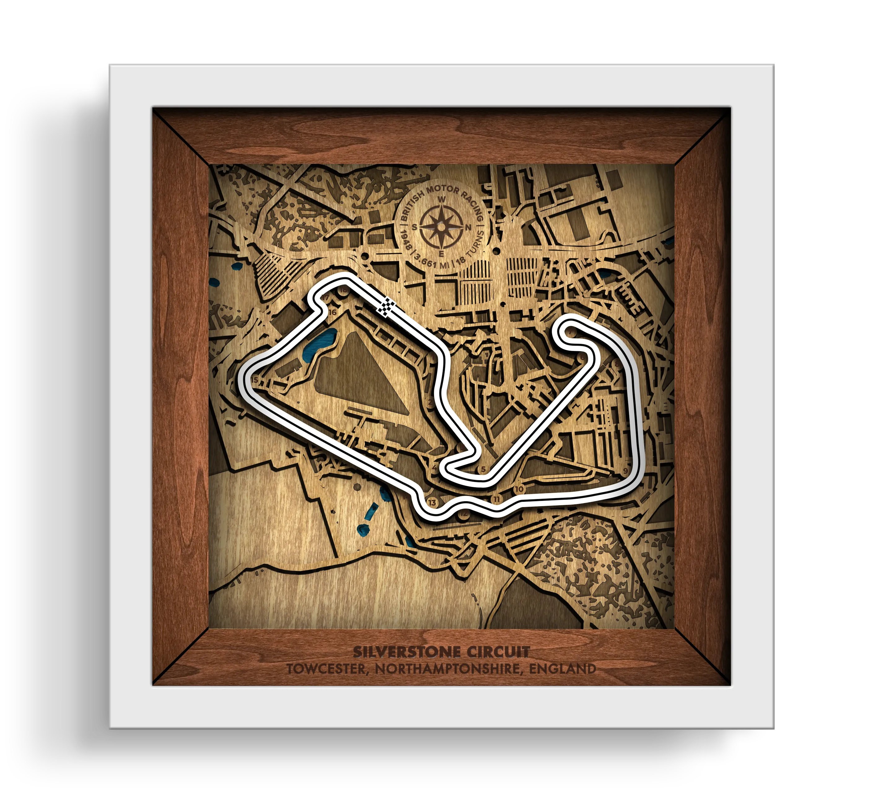 Handcrafted Silverstone Circuit layered wooden racetrack wall art in a white frame.