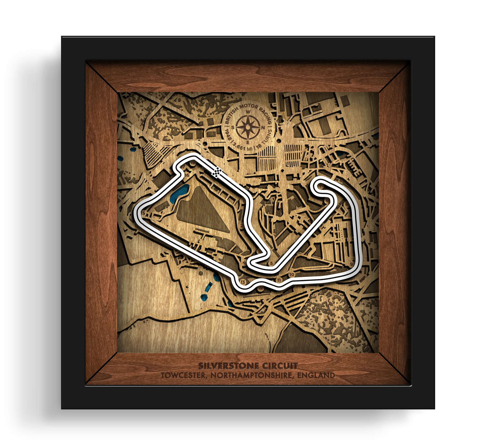 Handcrafted Silverstone Circuit layered wooden racetrack wall art in a black frame.