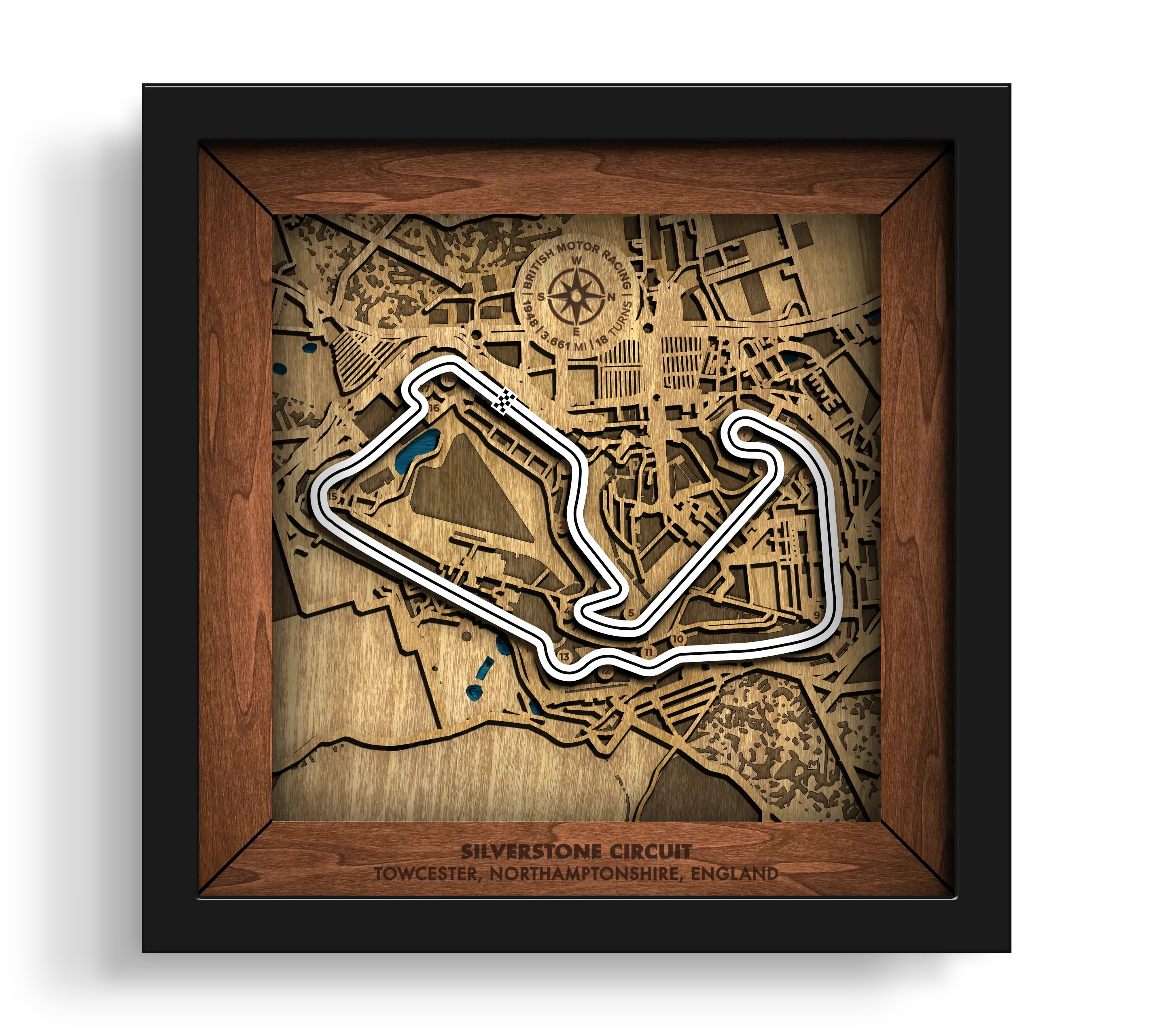 Handcrafted Silverstone Circuit layered wooden racetrack wall art in a black frame.