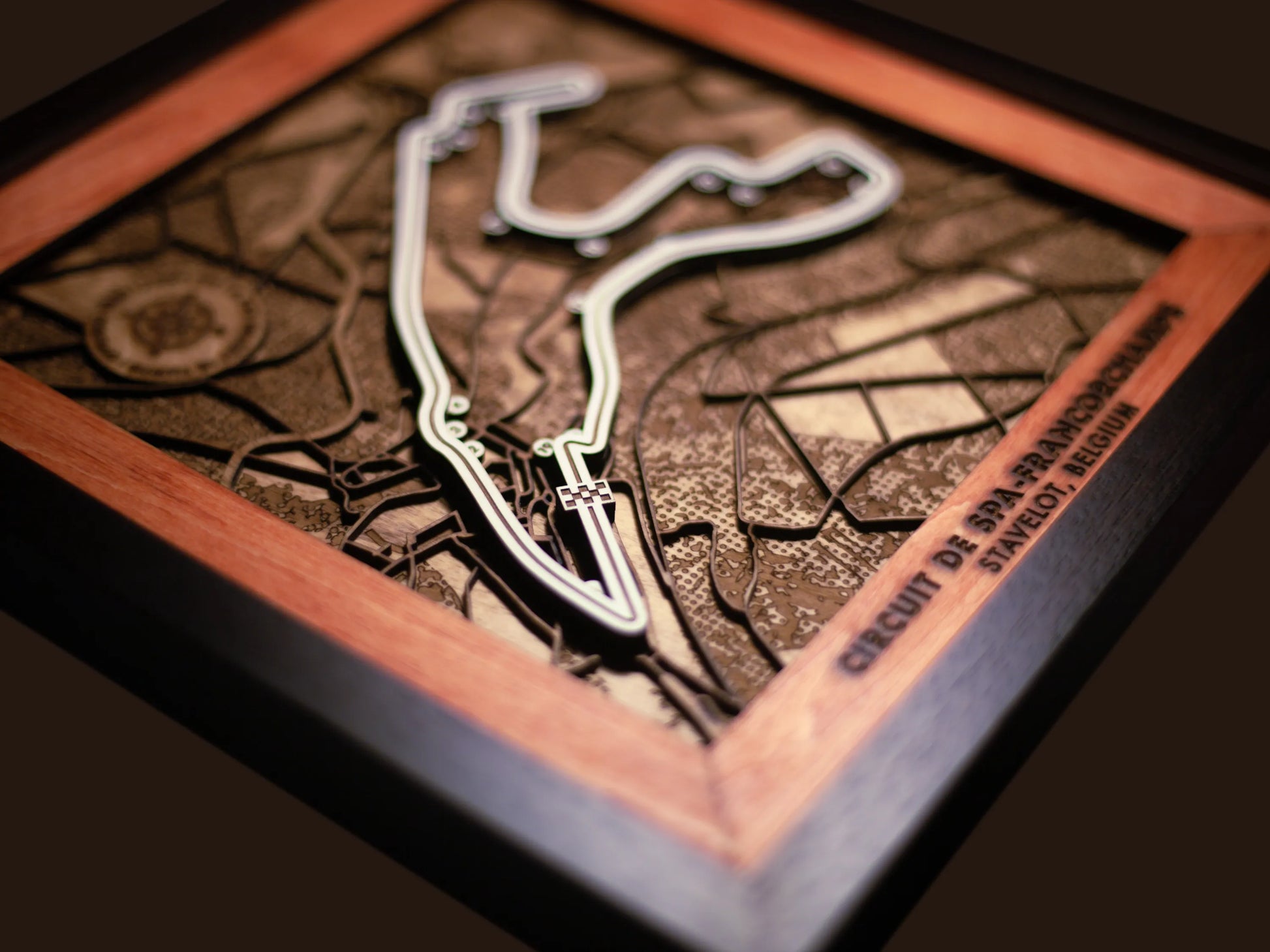 Close-up of the handcrafted layered wood construction and fine details of the Circuit de Spa-Francorchamps wall art.