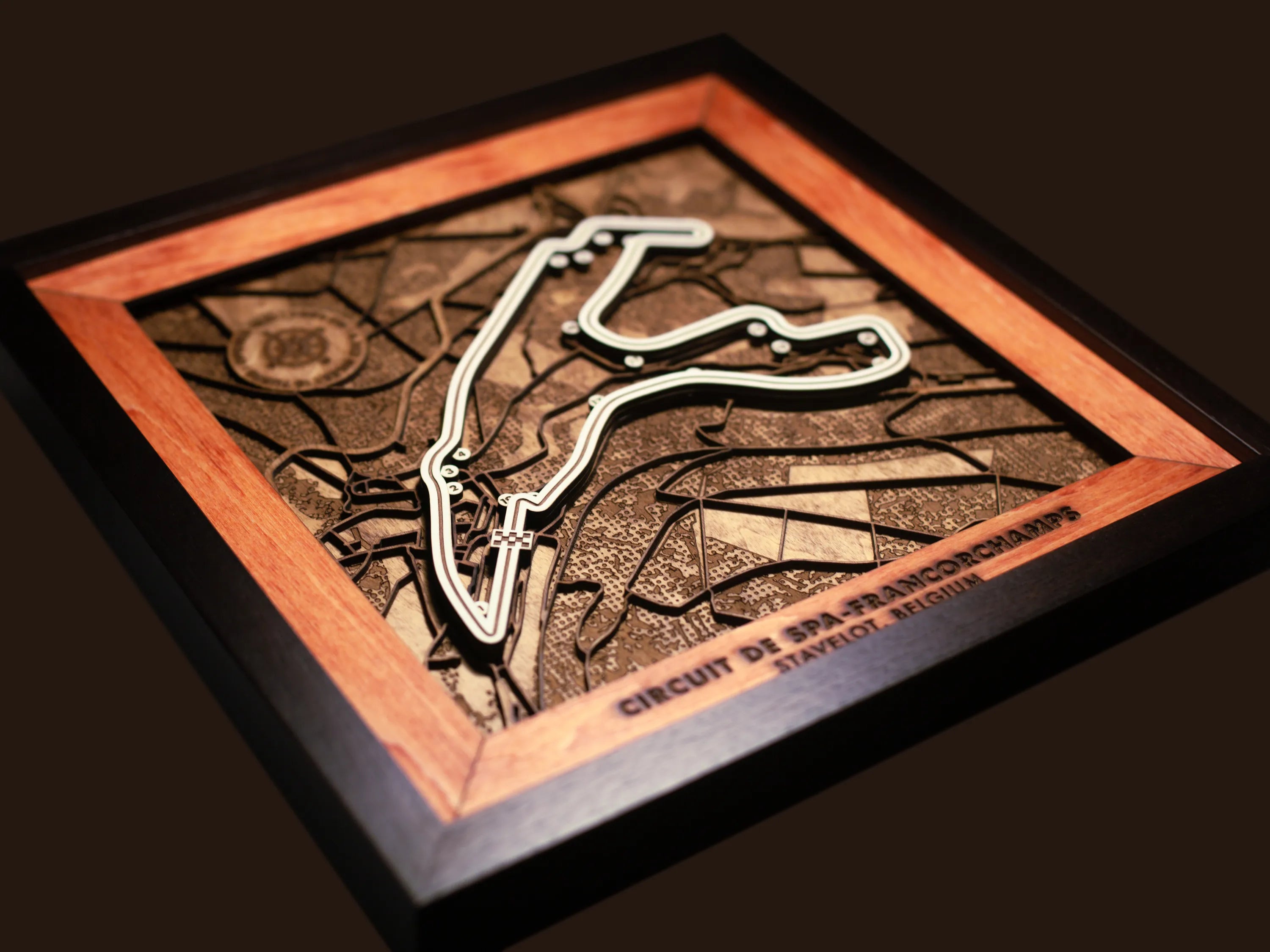 Close-up of the handcrafted layered wood construction and fine details of the Circuit de Spa-Francorchamps wall art.