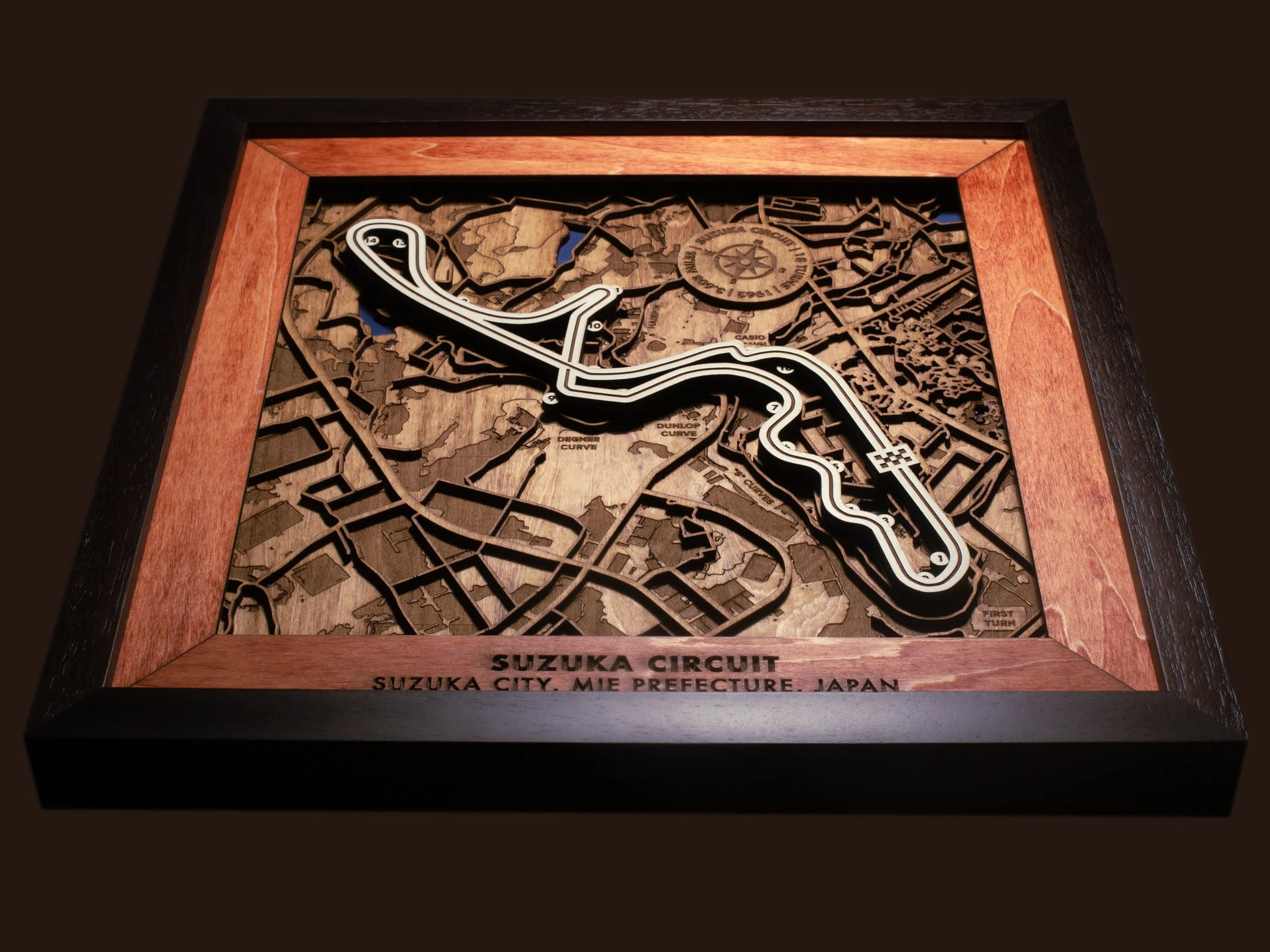 Close-up of the handcrafted layered wood construction and fine details of the Suzuka Circuit wall art.