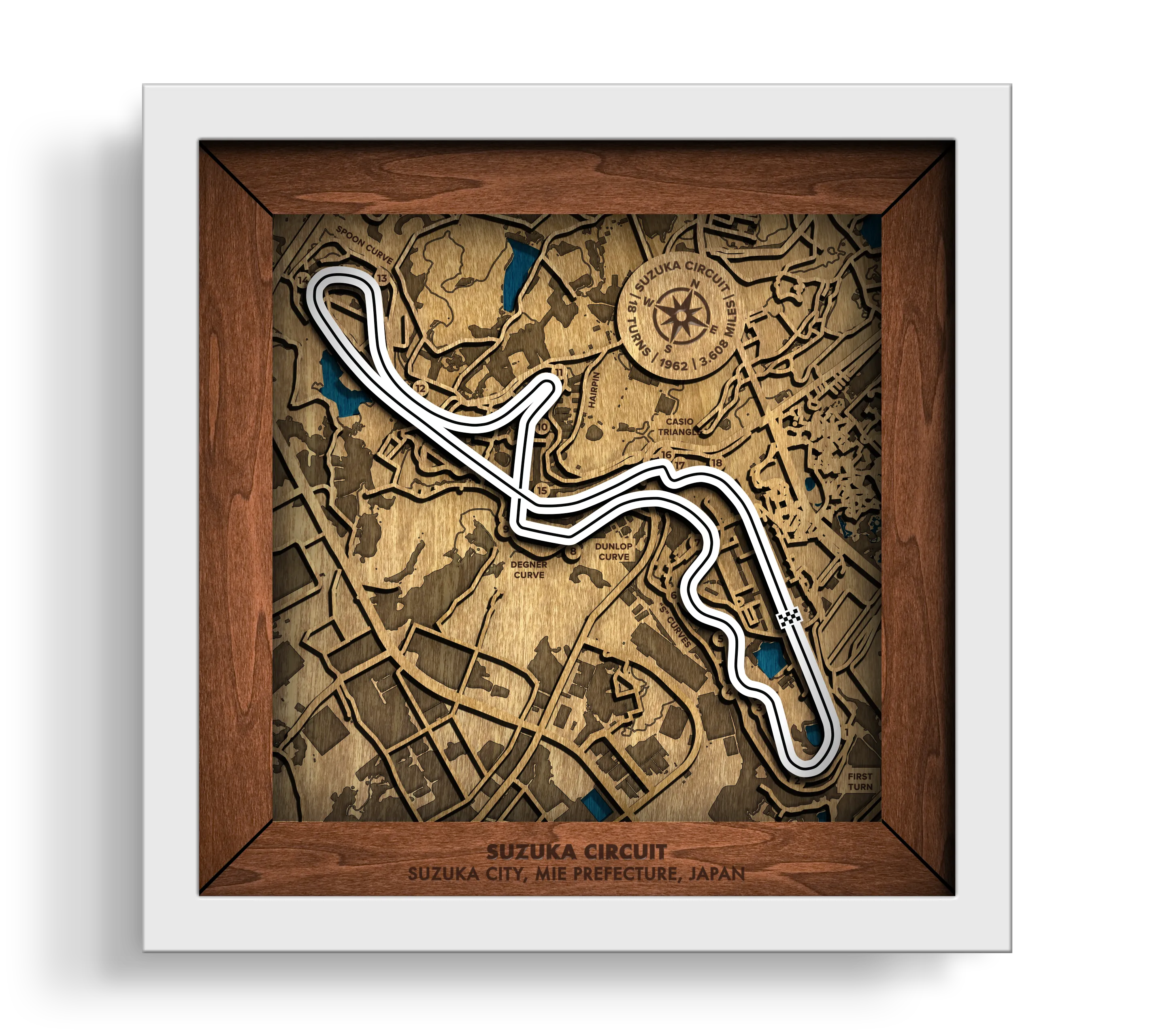 Handcrafted Suzuka Circuit layered wooden racetrack wall art in a white frame.