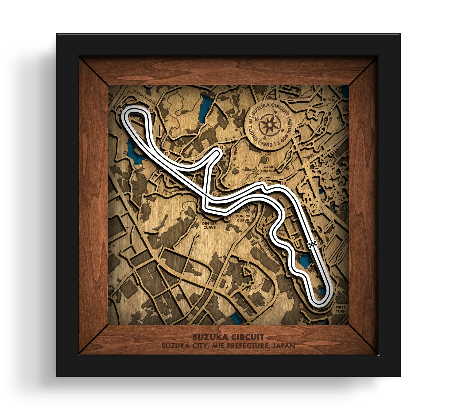Handcrafted Suzuka Circuit layered wooden racetrack wall art in a black frame.