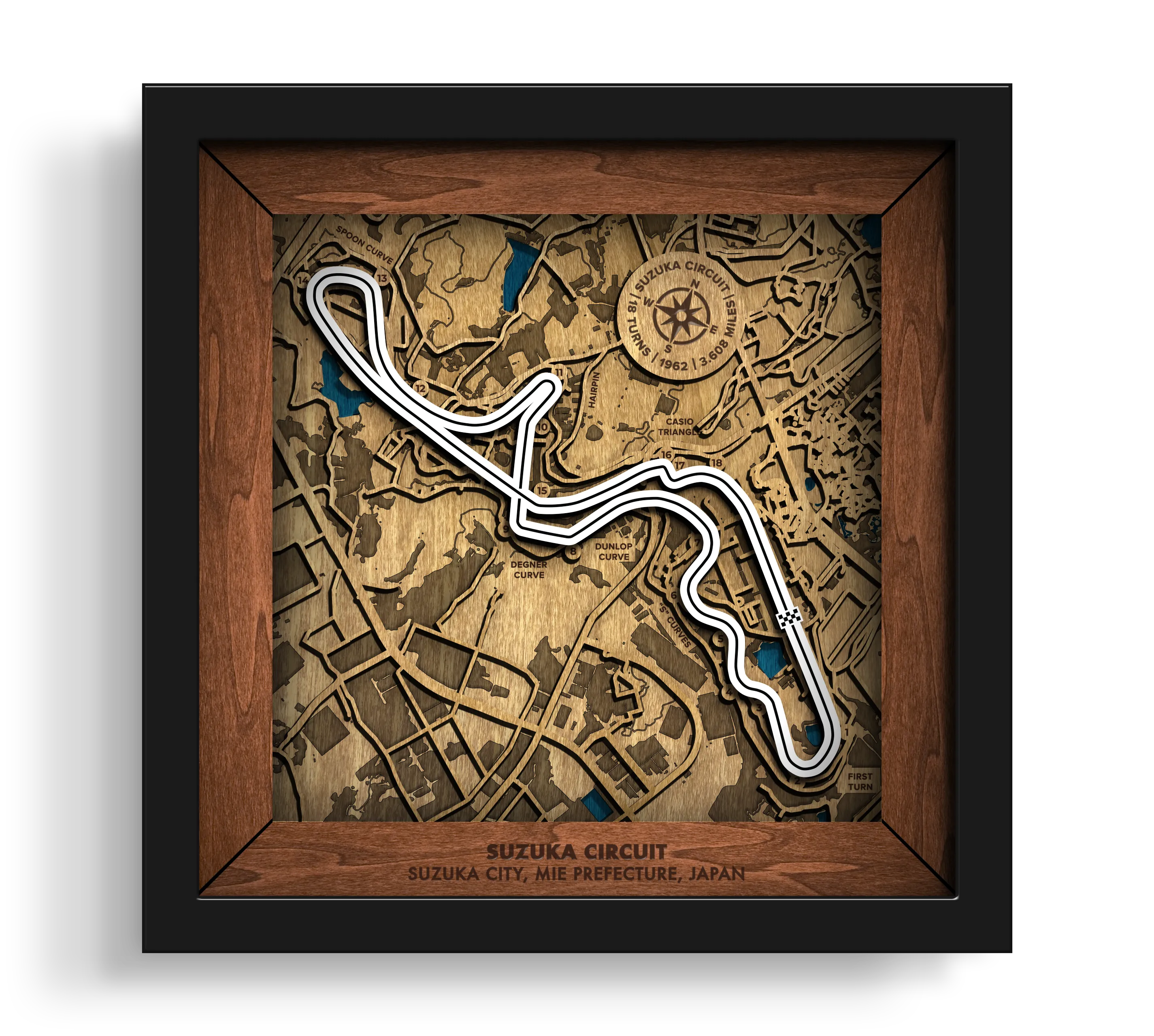 Handcrafted Suzuka Circuit layered wooden racetrack wall art in a black frame.