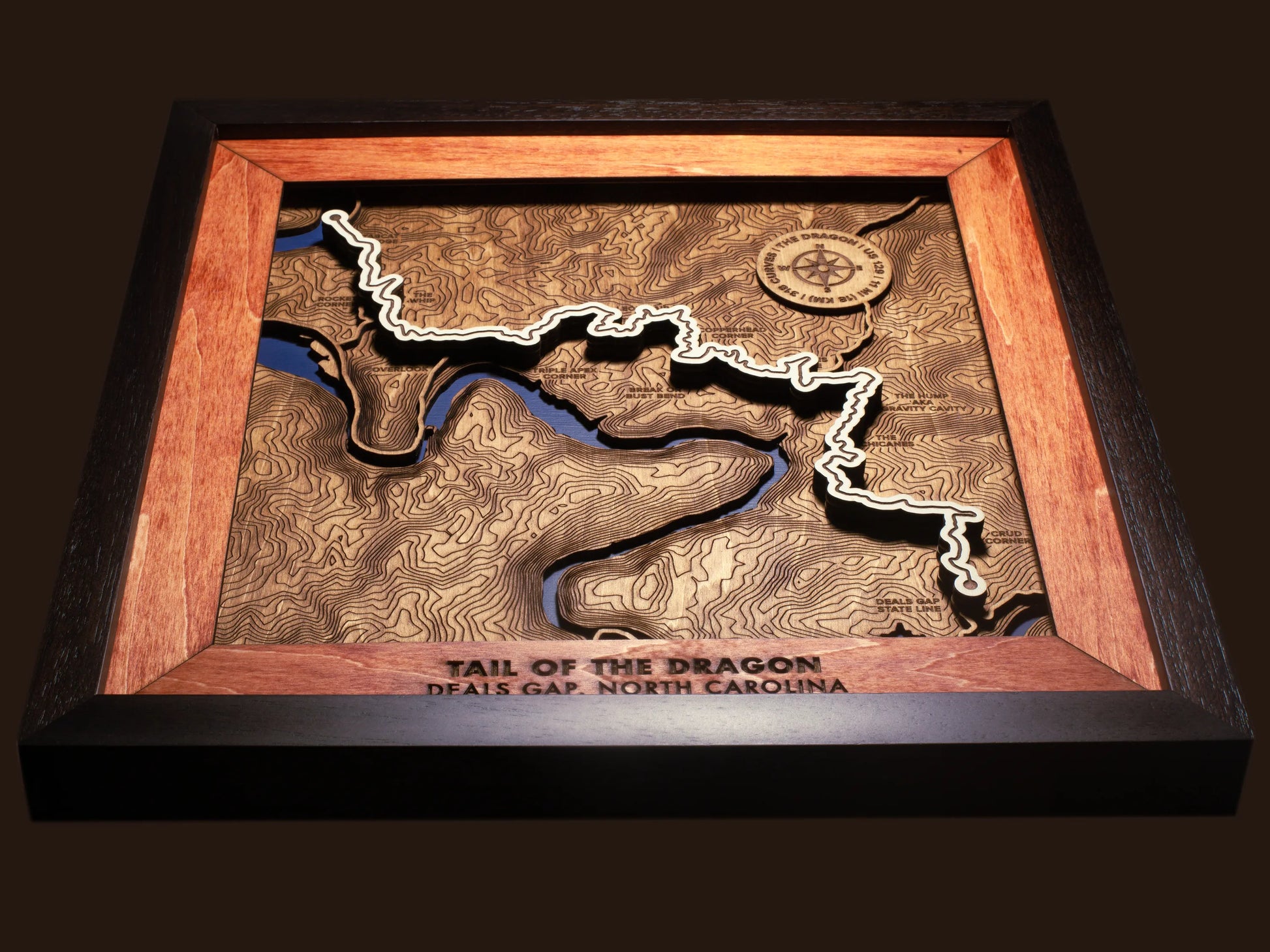 Close-up of the handcrafted layered wood construction and fine details of the Tail of the Dragon wall art.