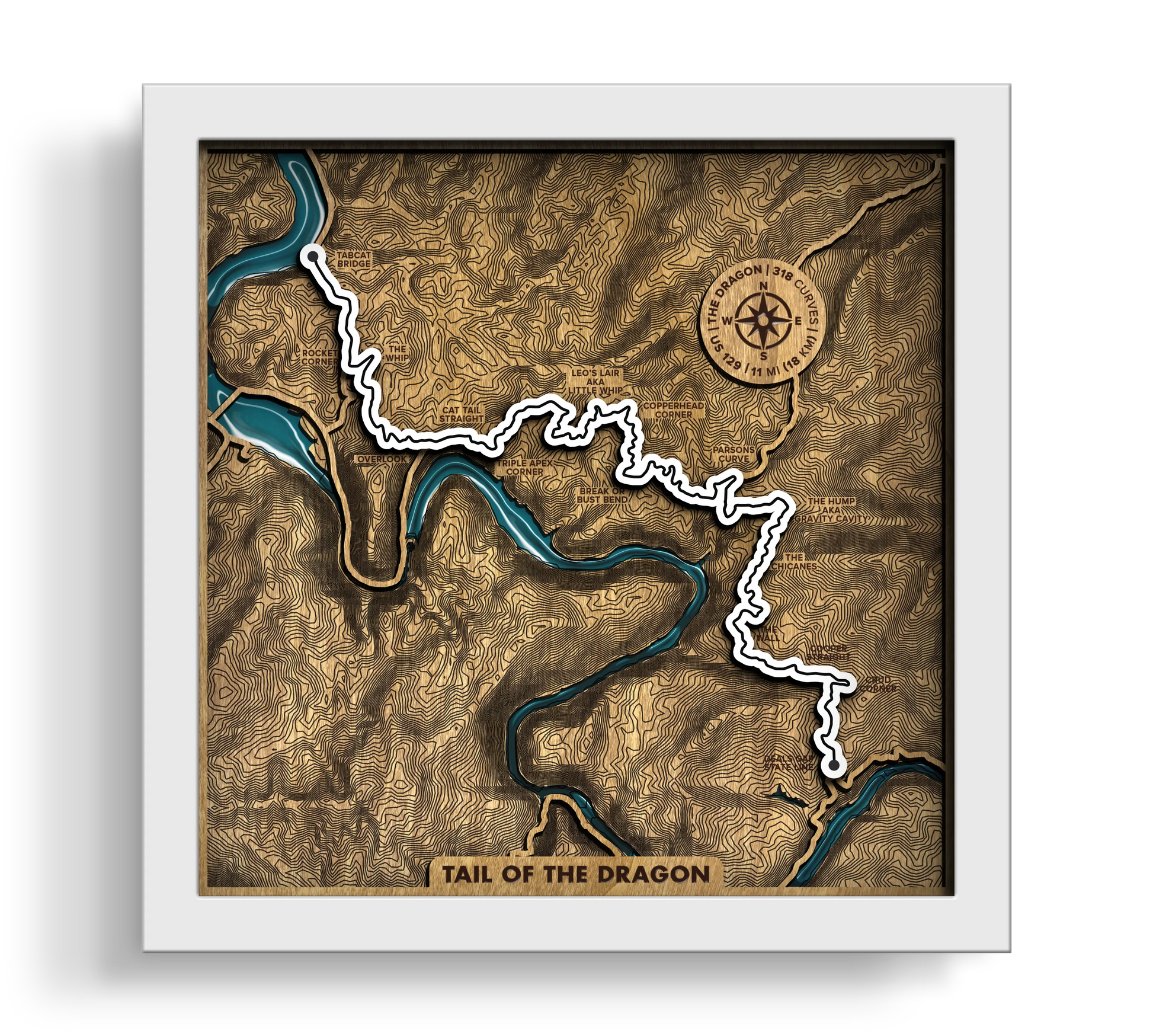Handcrafted Tail of the Dragon layered wooden wall art with an epoxy resin finish in a white frame.