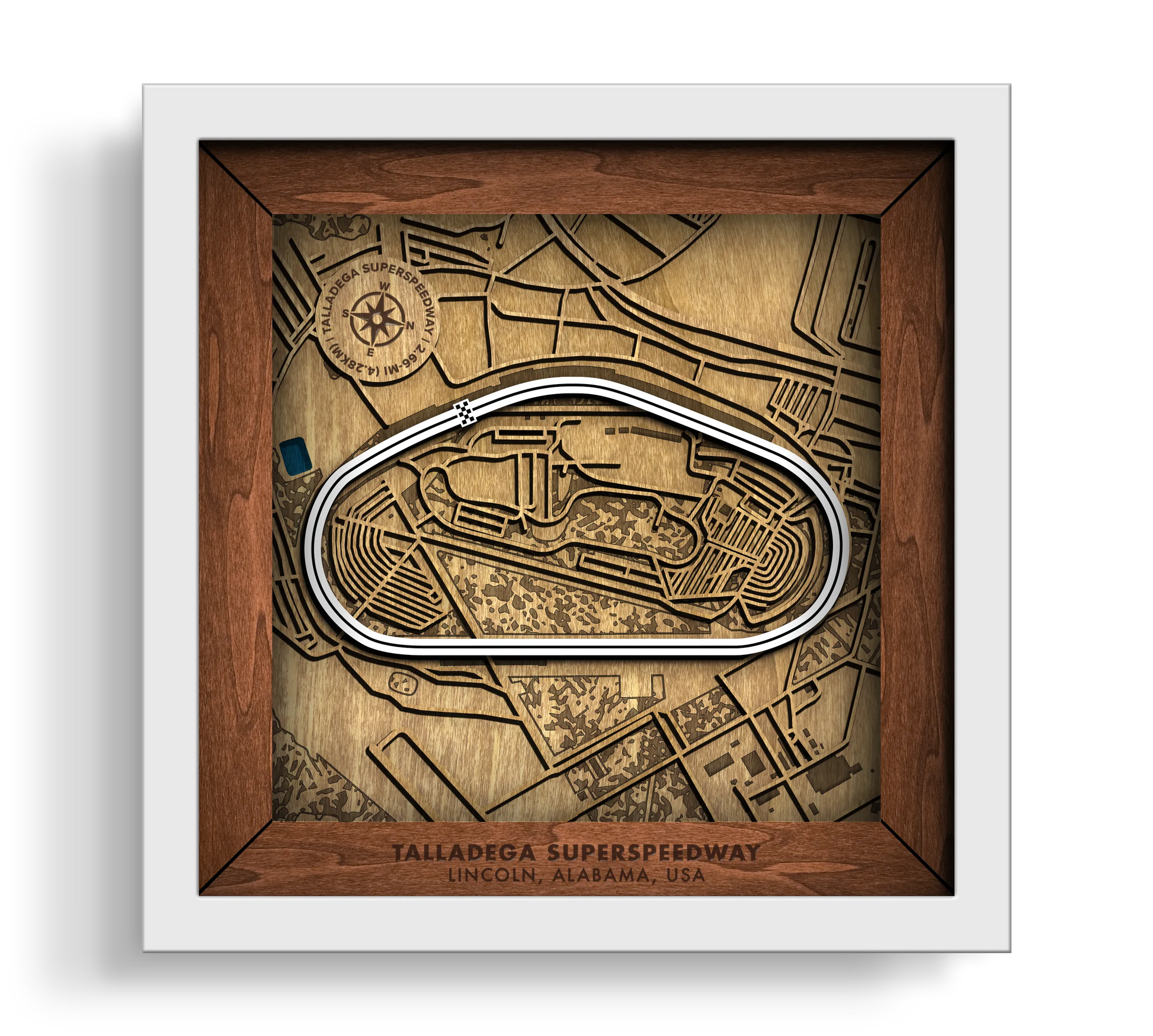 Handcrafted Talladega Superspeedway layered wooden racetrack wall art in a white frame.