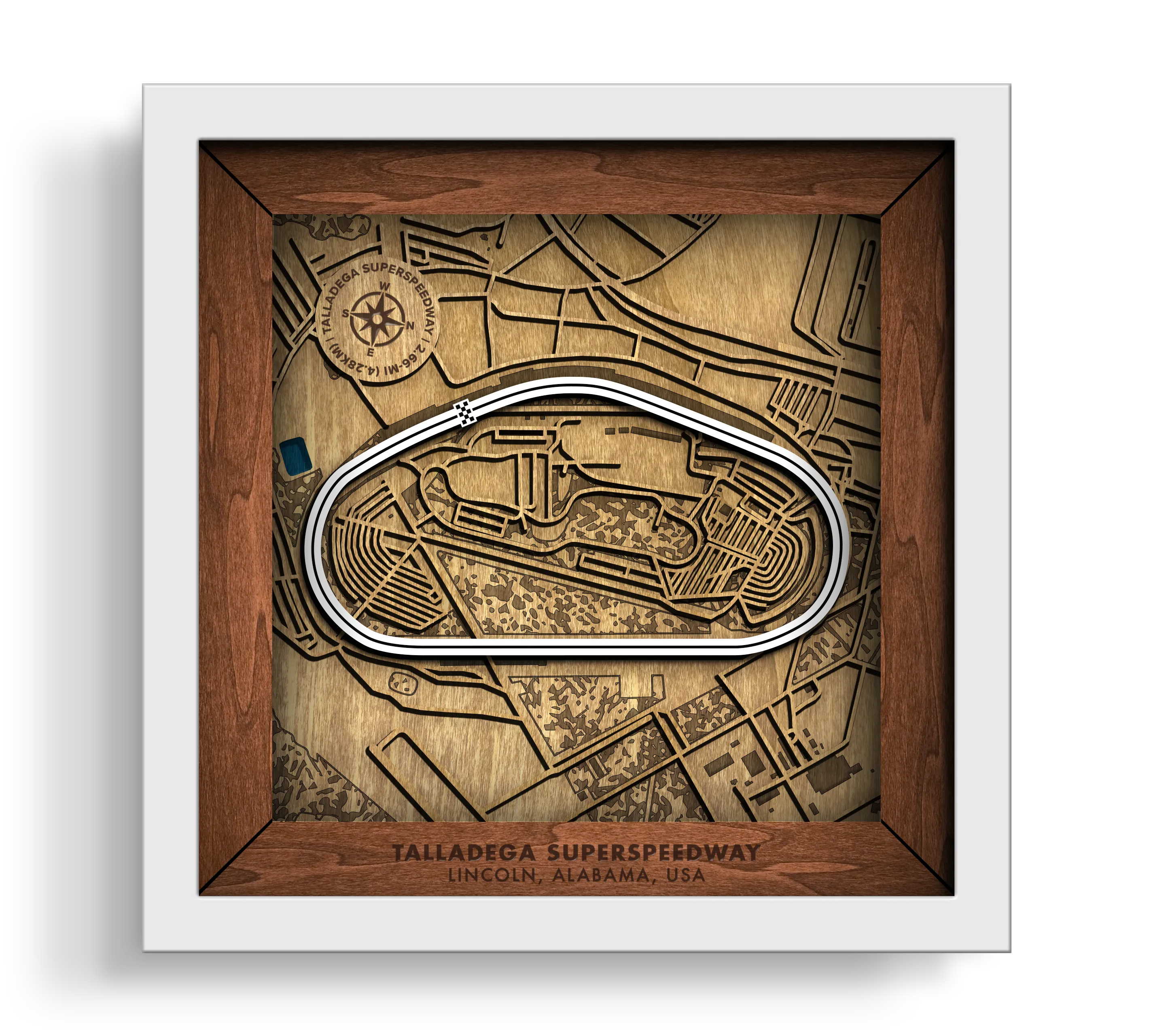 Handcrafted Talladega Superspeedway layered wooden racetrack wall art in a white frame.