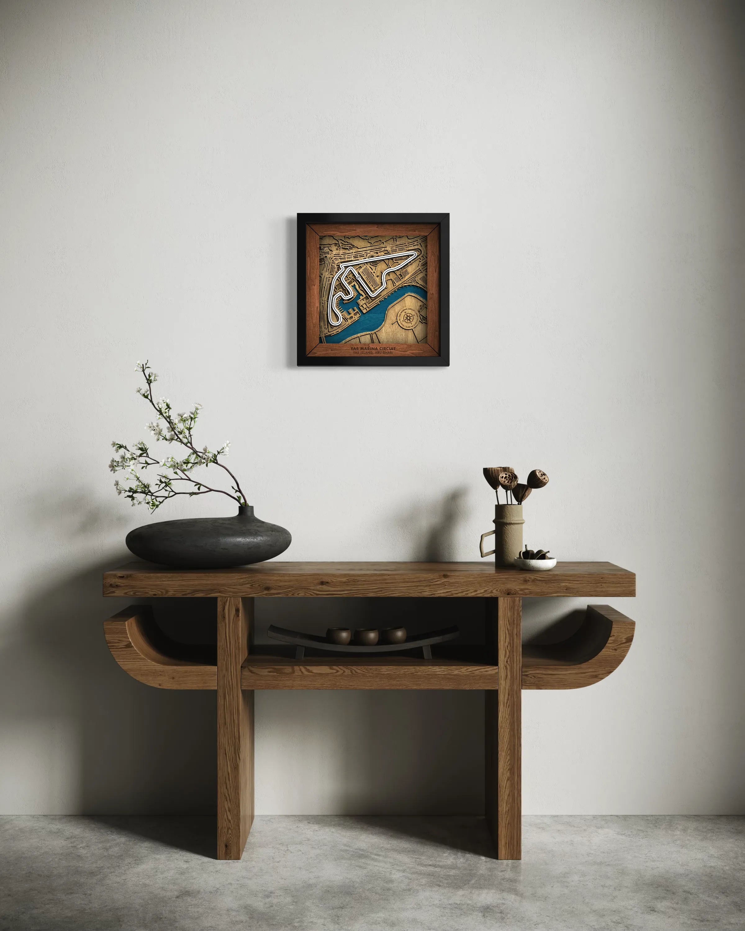 Handcrafted Yas Marina Circuit layered wooden racetrack wall art displayed in a modern living room.